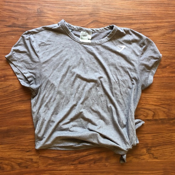 Gymshark Tops - Gym shark grey shirt! Ties on the bottom.